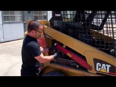 cat skid steer implement lockout|cat skid steer arms.